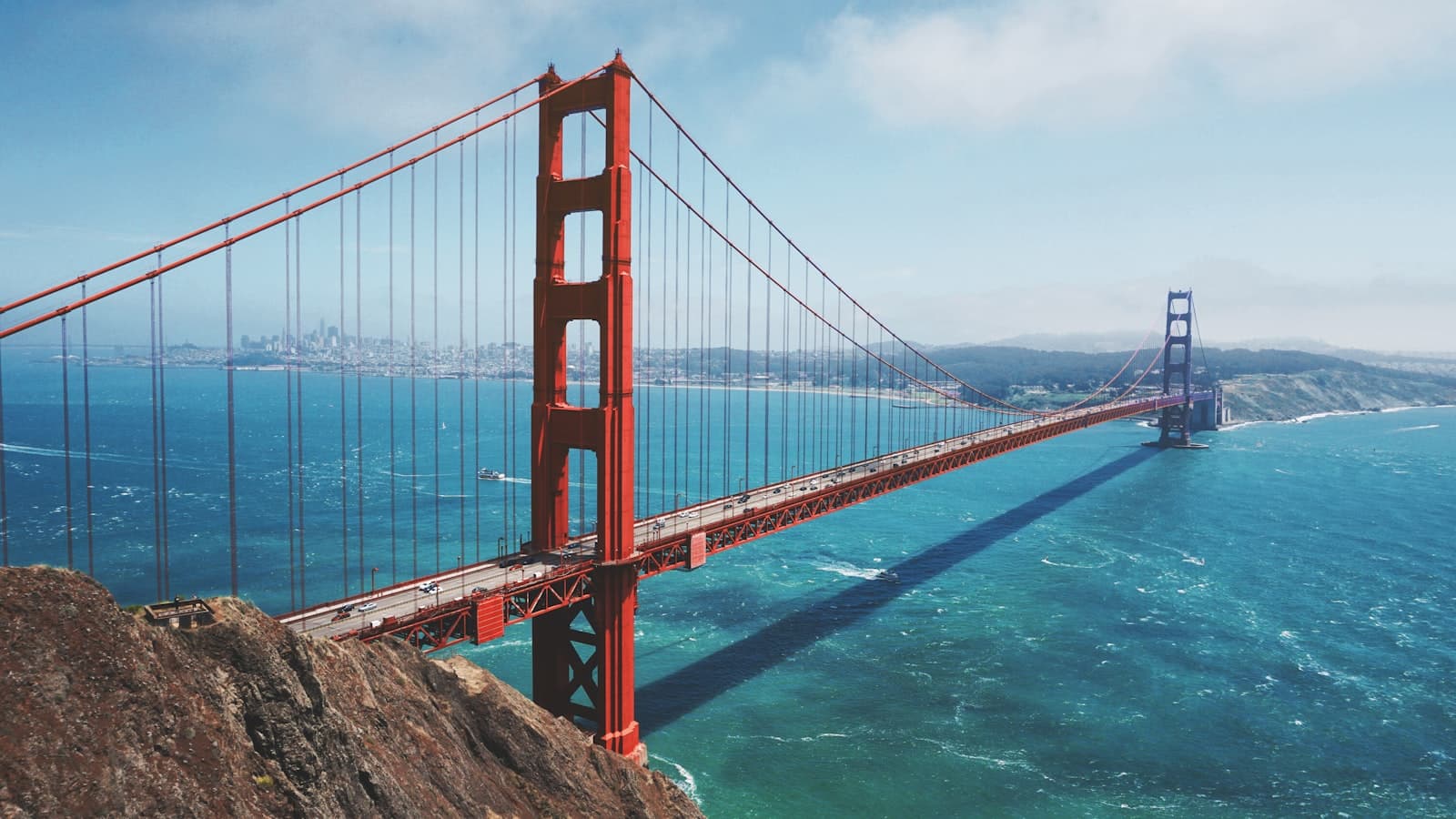 American flag over a landmark landscape